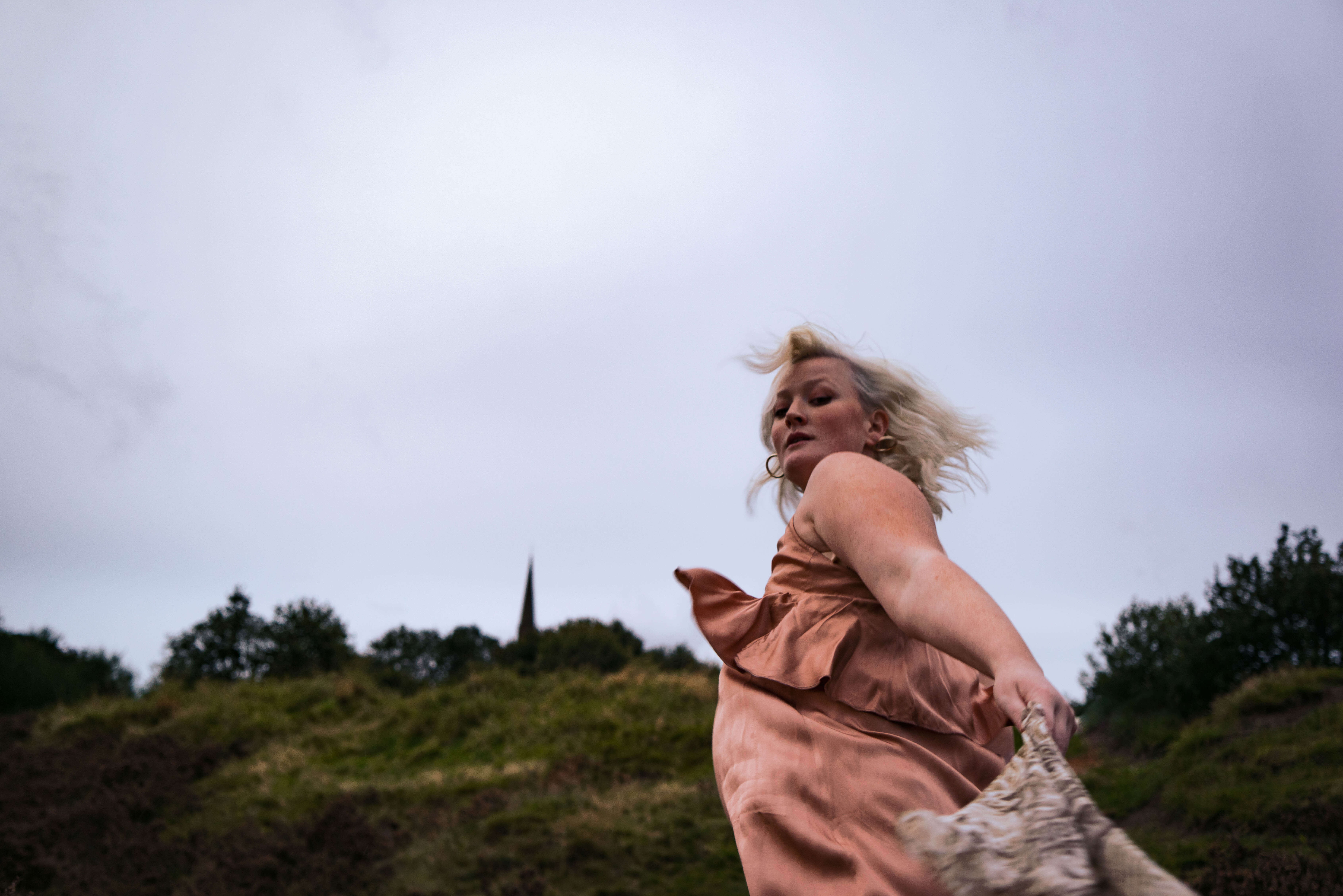 A blurred picture of a woman running on a hill