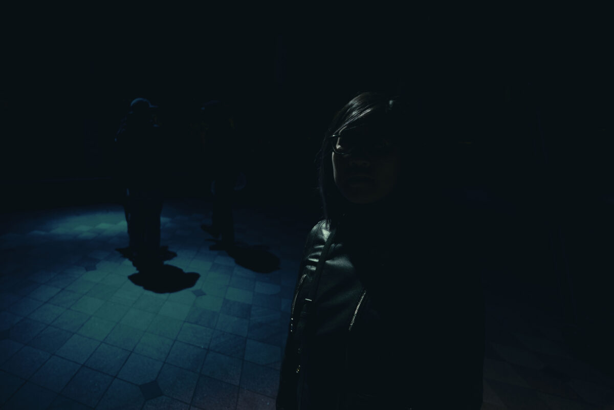 Low key photo of a woman in the darkness