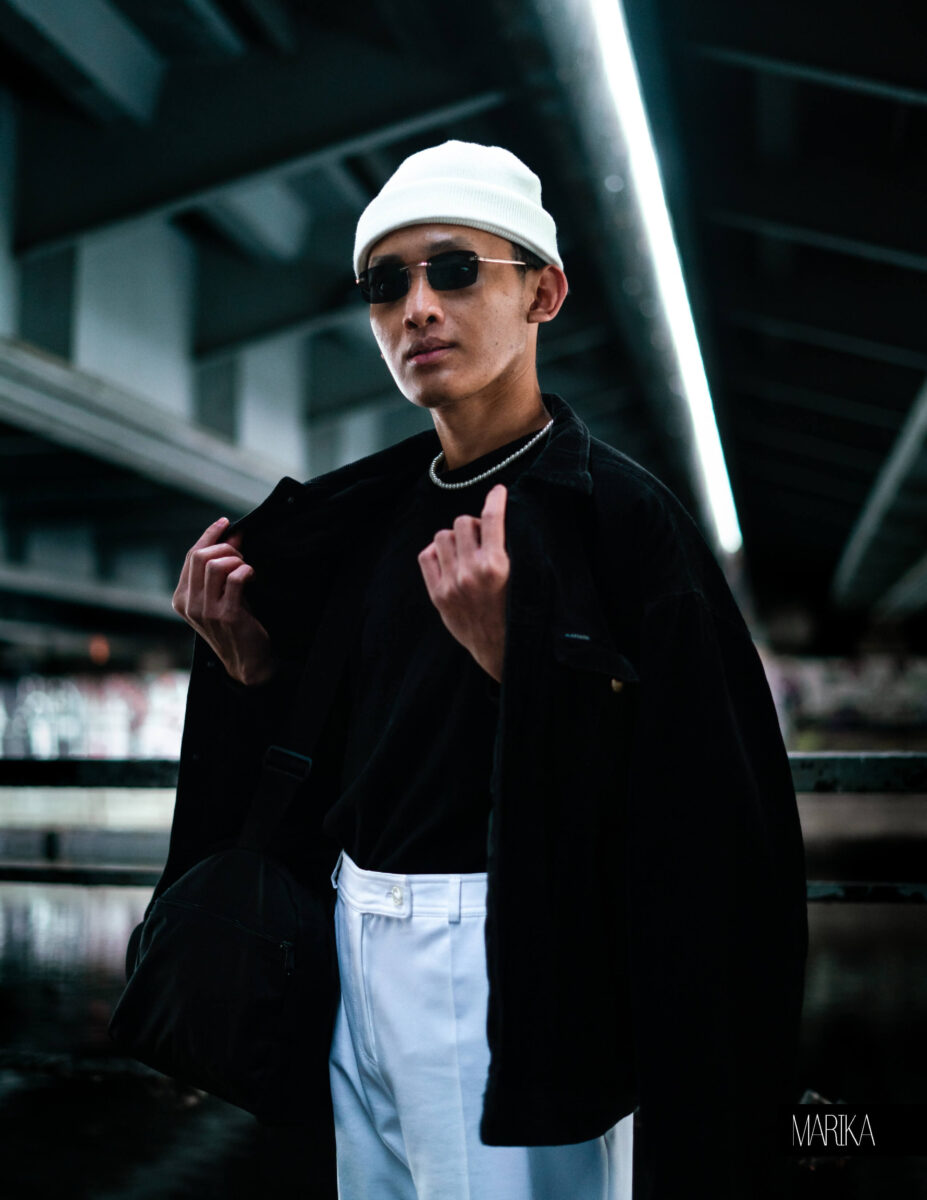 Portrait of a man under a bridge