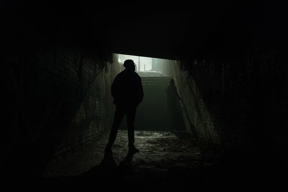 People in a tunnel on a foggy night in England