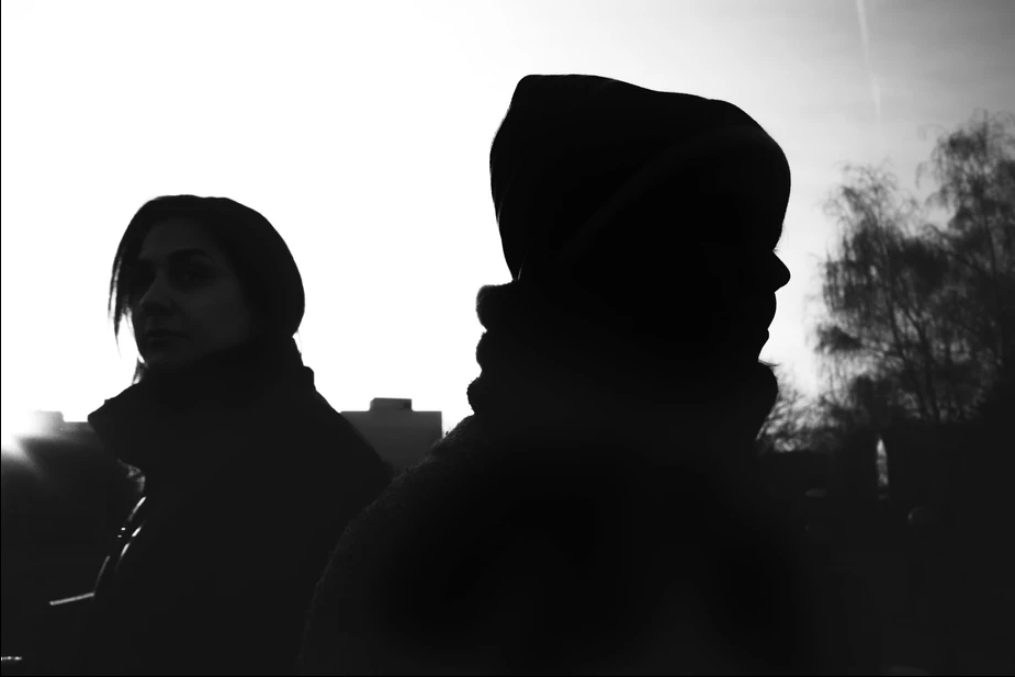 silhouettes of people on a street