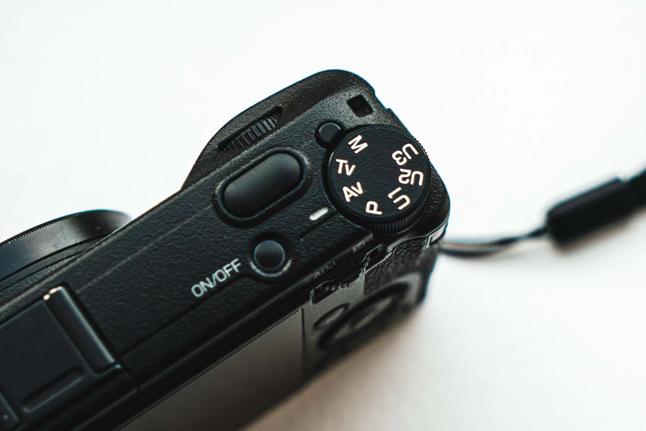 Ricoh GRiiix A closeup on the camera modes