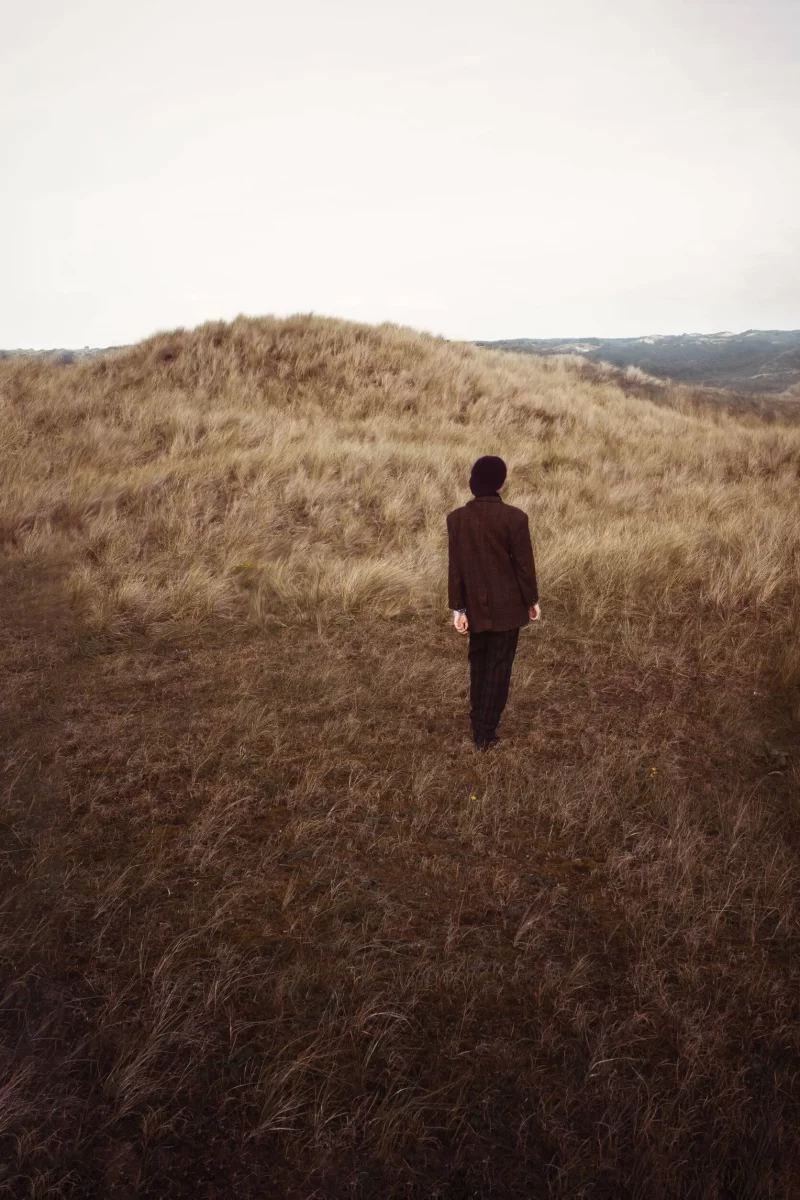 woman on a grassy hill