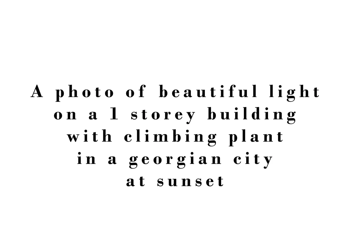 A photo of beautiful light on a 1 storey building with climbing plant in a Georgian city at sunset