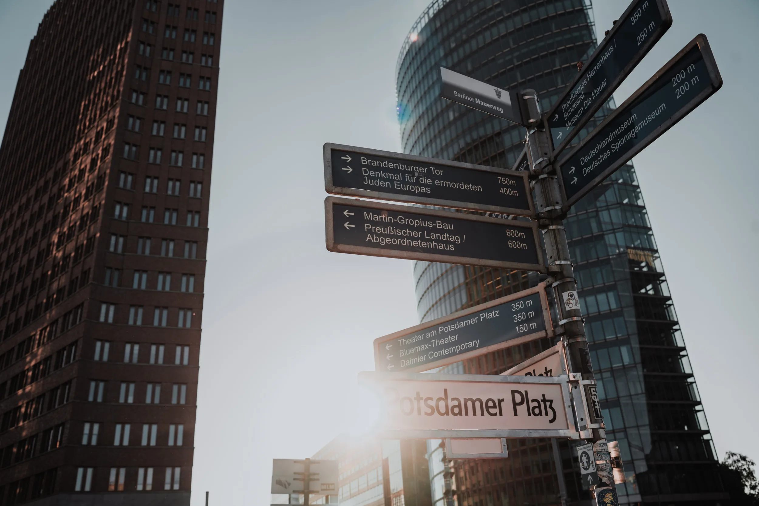 Potsdamer Platz on a sunny day with a closeup on the street sign