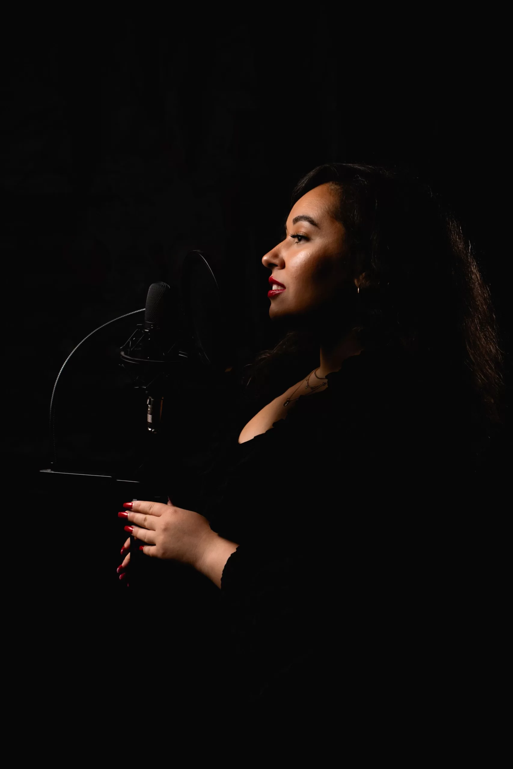 a singer in front of a microphone by Fedor Vasilev photographer in Vienna