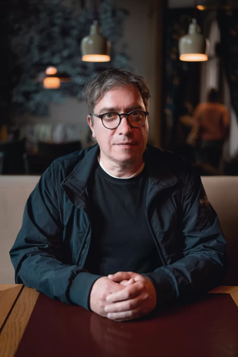 portrait of a man sitting in a cafe