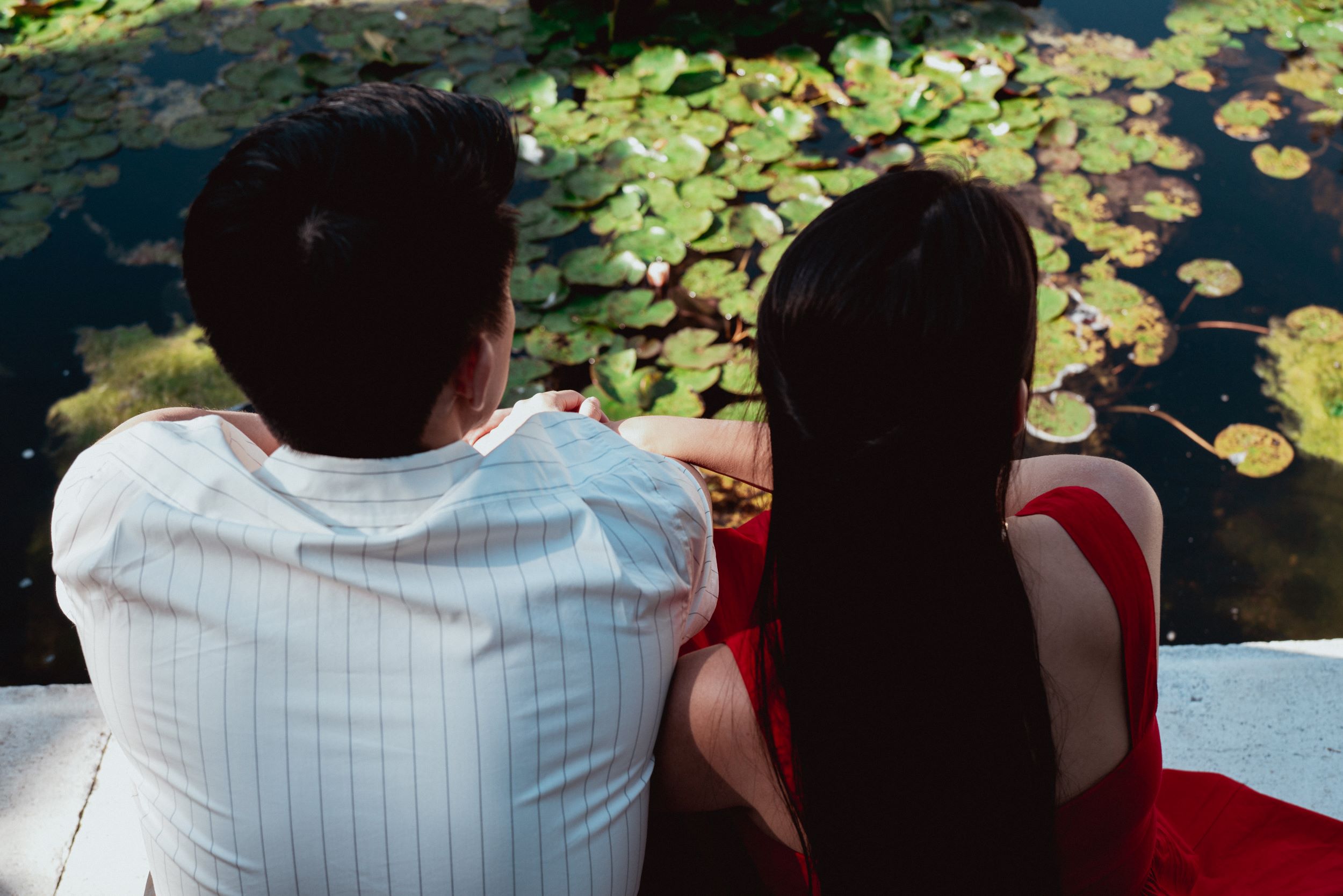 Couple photographer in Vienna, A couple in love sitting by a pond
