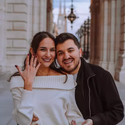 happy just engaged couple at vienna's town hall at a proposal photoshoot