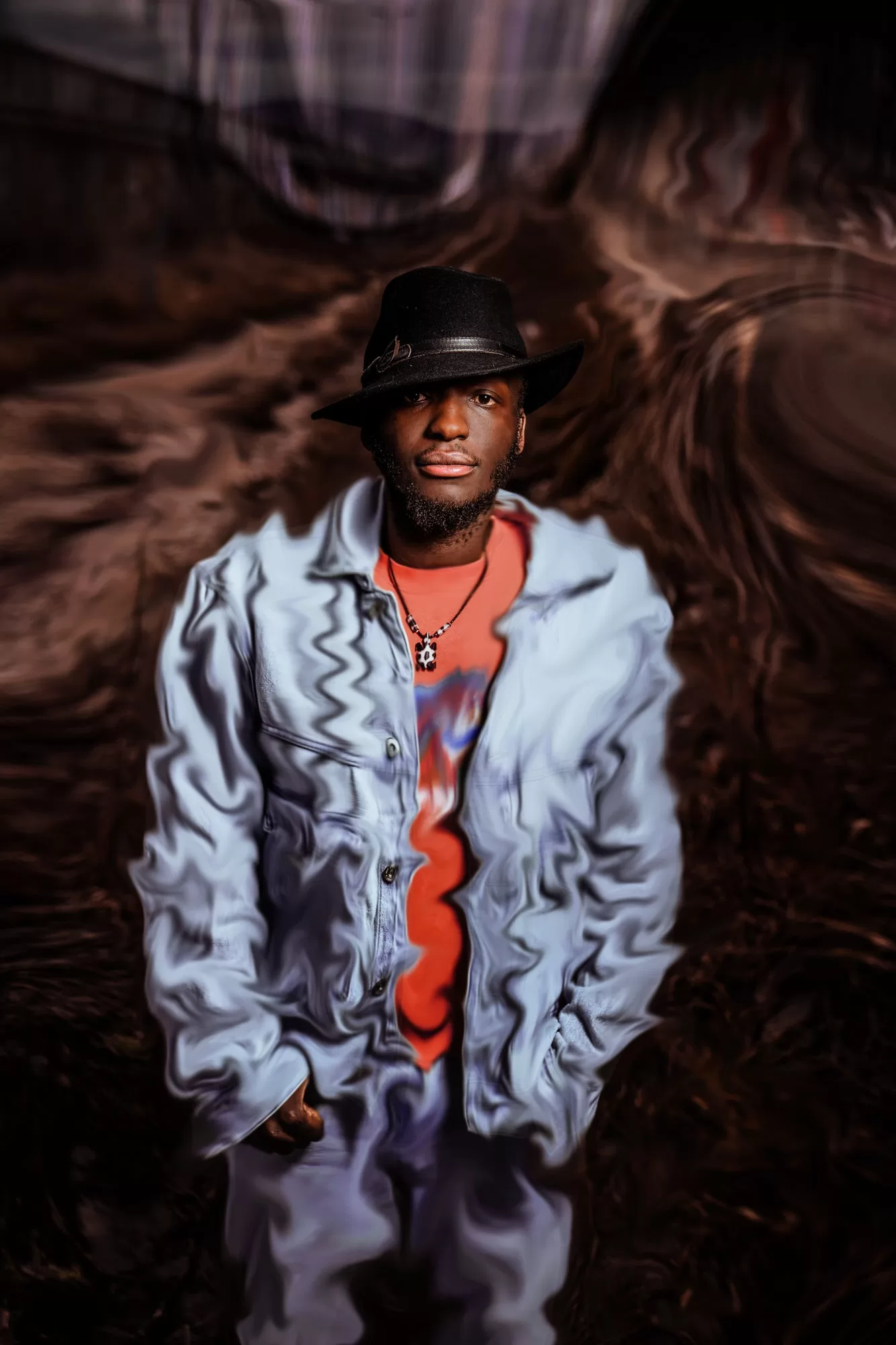 Experimental portrait of a man in a black hat