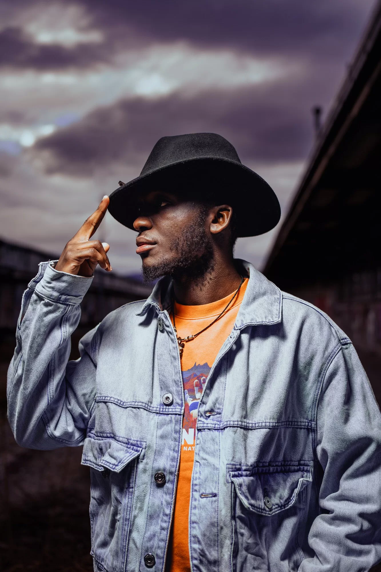 dramatic photo of a man in a hut