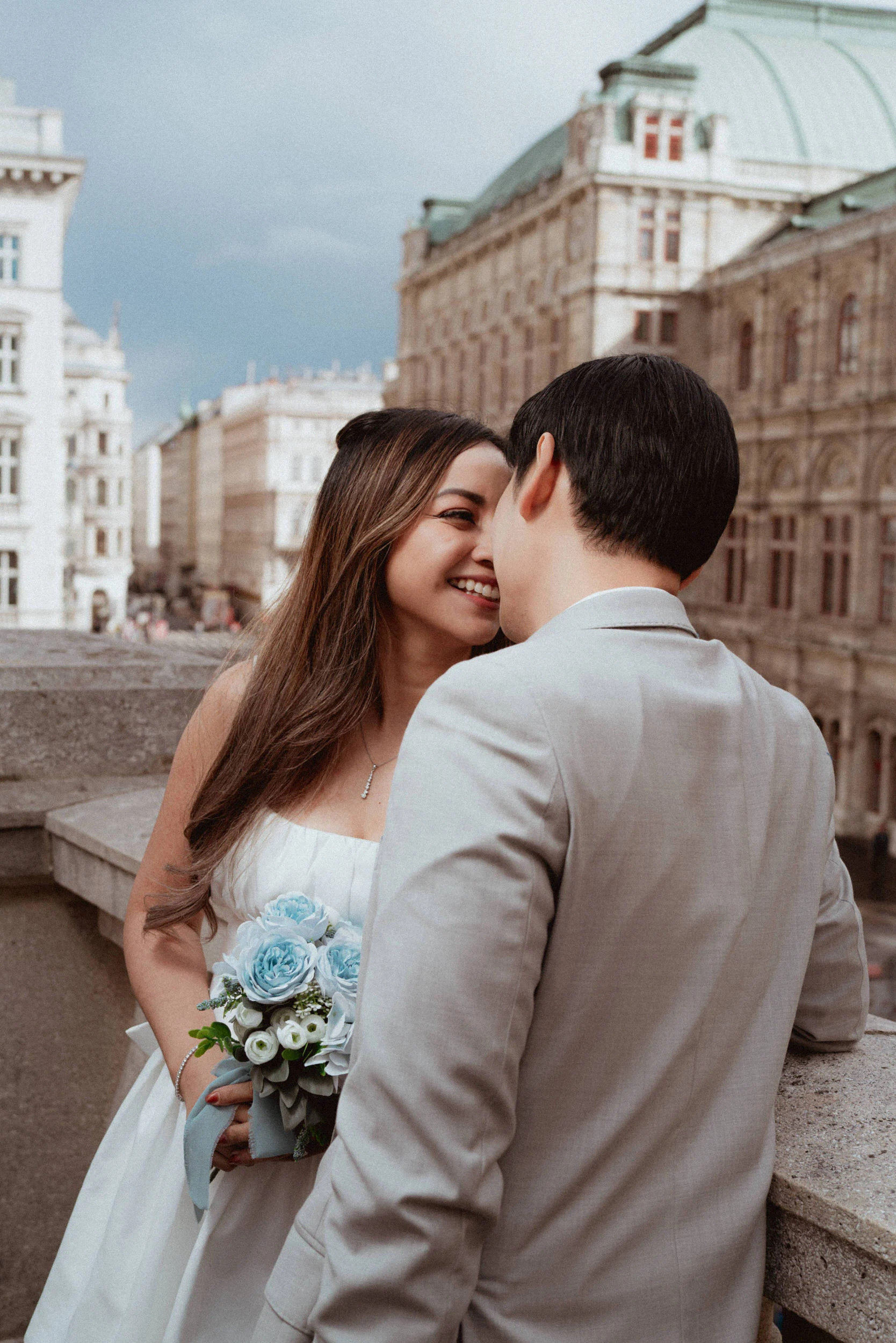 A couple kissing on Albertina terrace with soft light