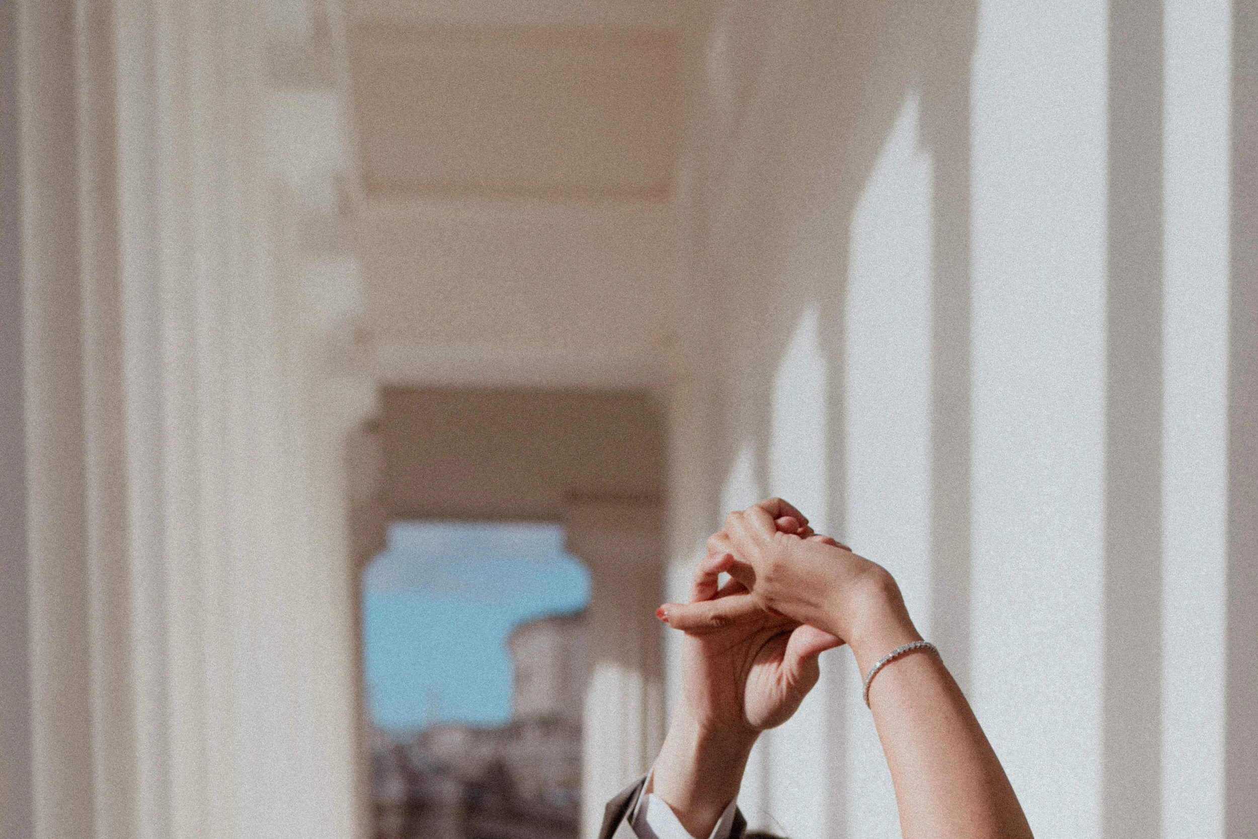 Detail photo of hands in the moment of a dance of a couple at Theseus Temple in Vienna