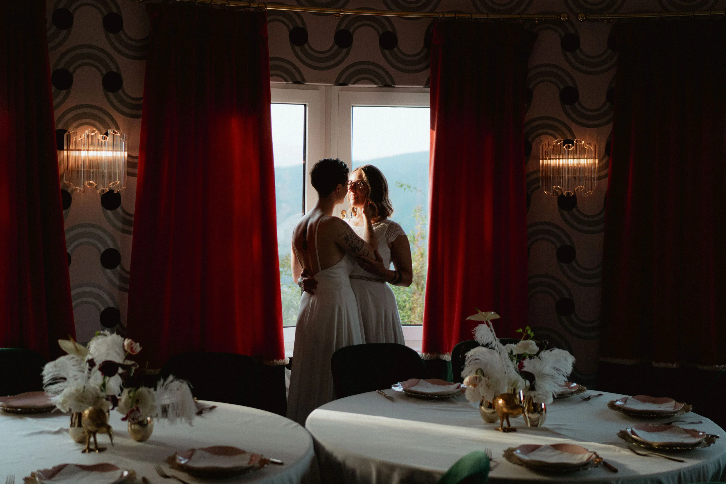 Wedding couple photo by a window at a wedding venue Fernblick in Austria