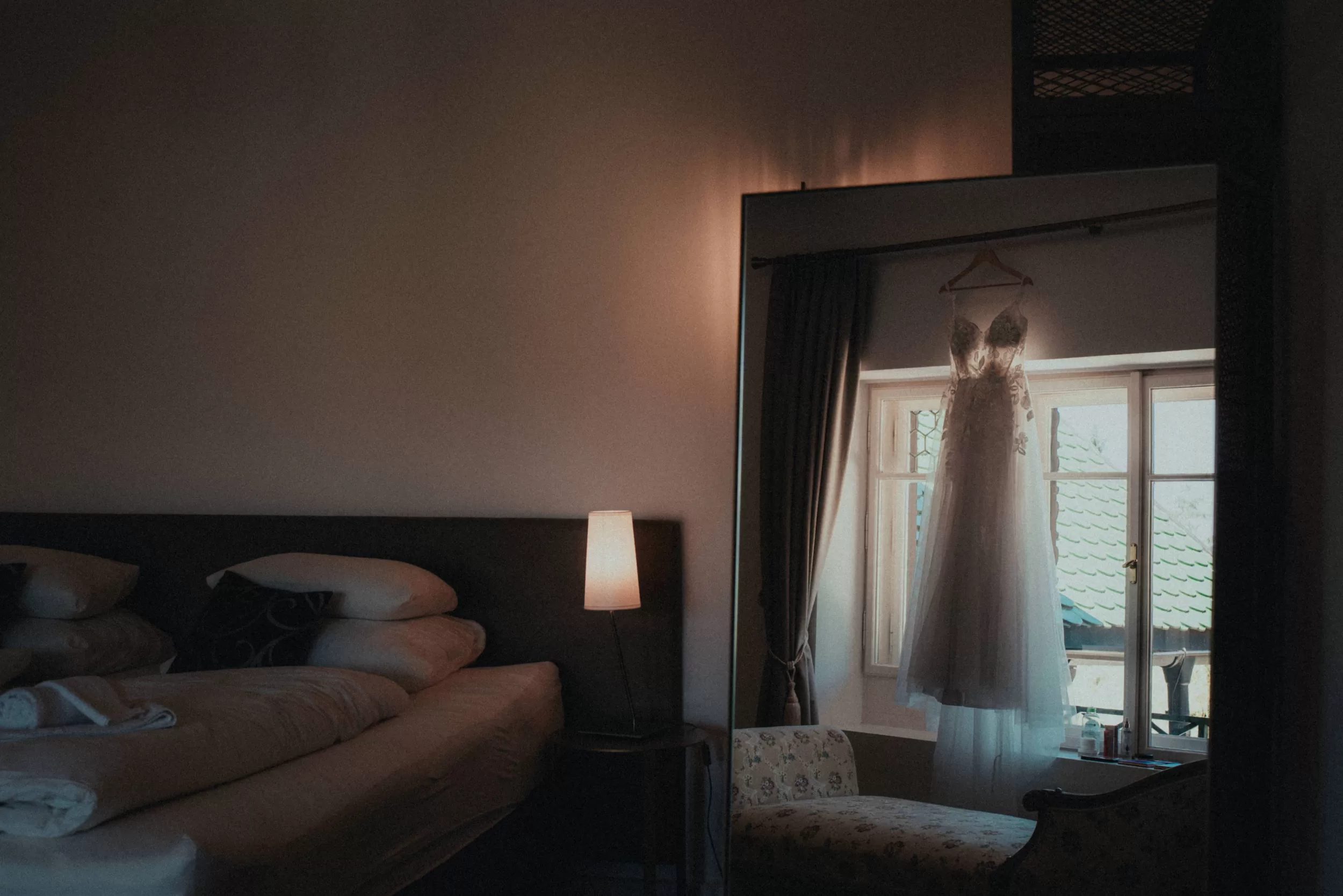 Wedding dress in a hotel room by photographer Fedor Vasilev
