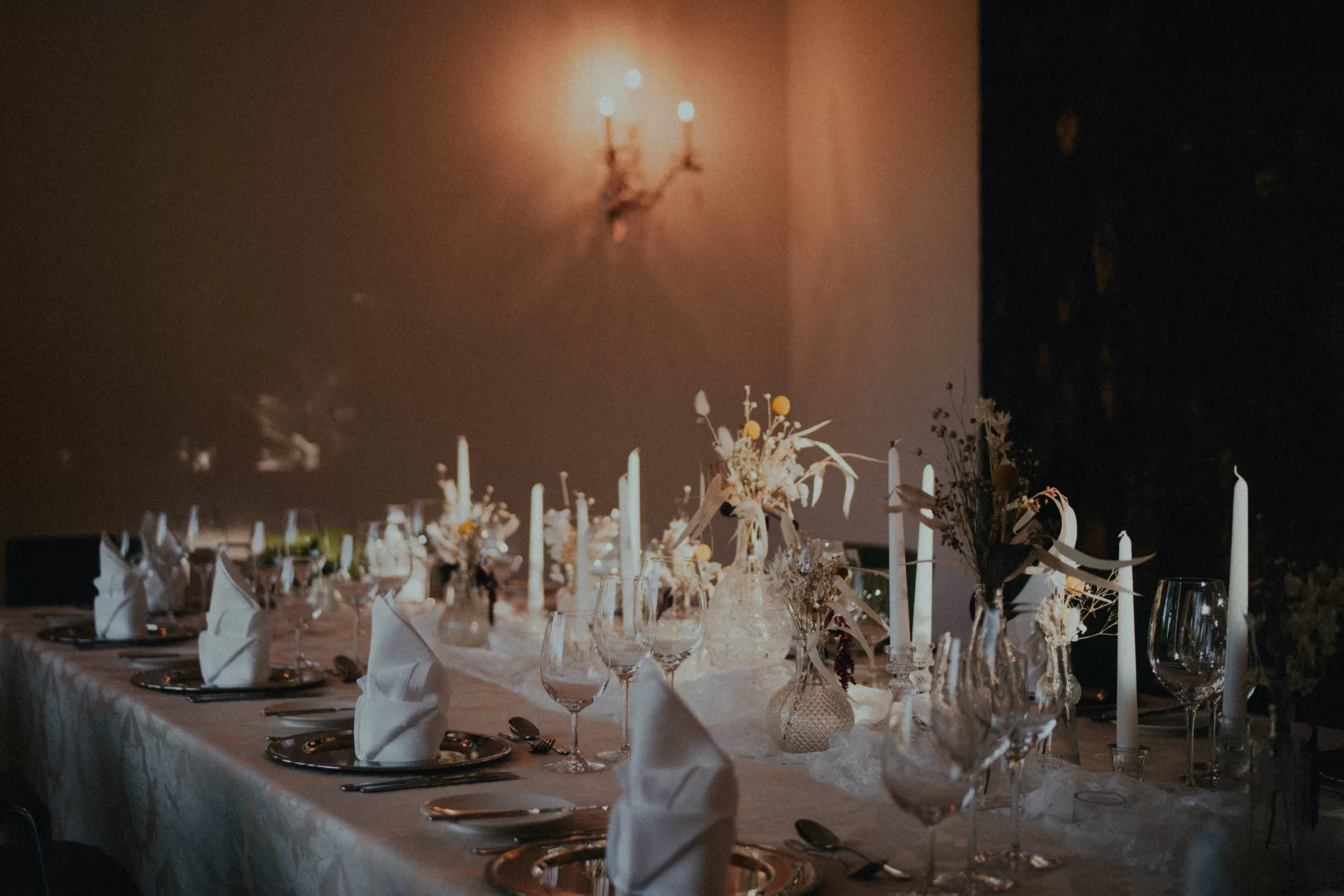 decorated wedding table at a wedding venue with dramatic light