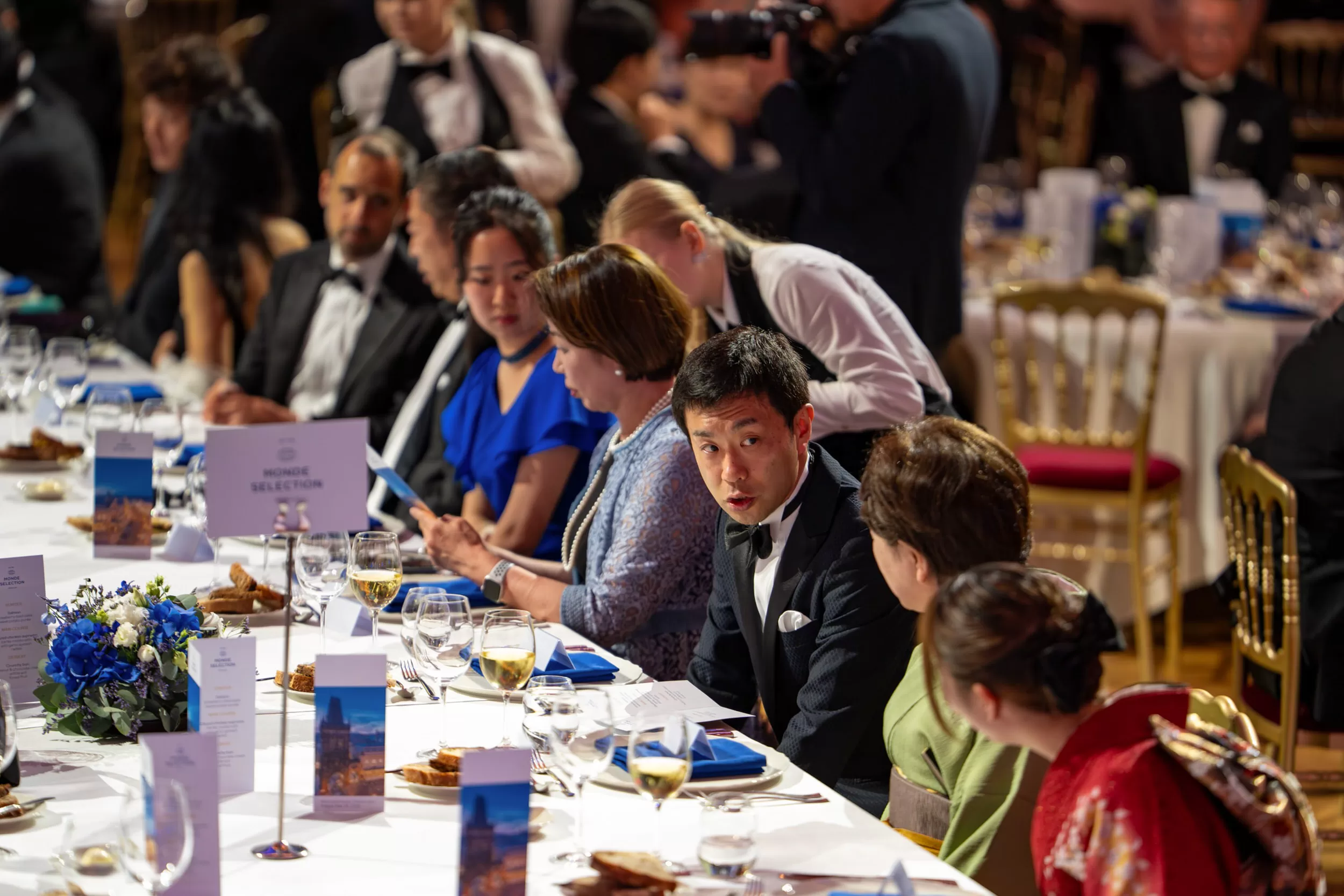People conversing at a table before their gala dinner