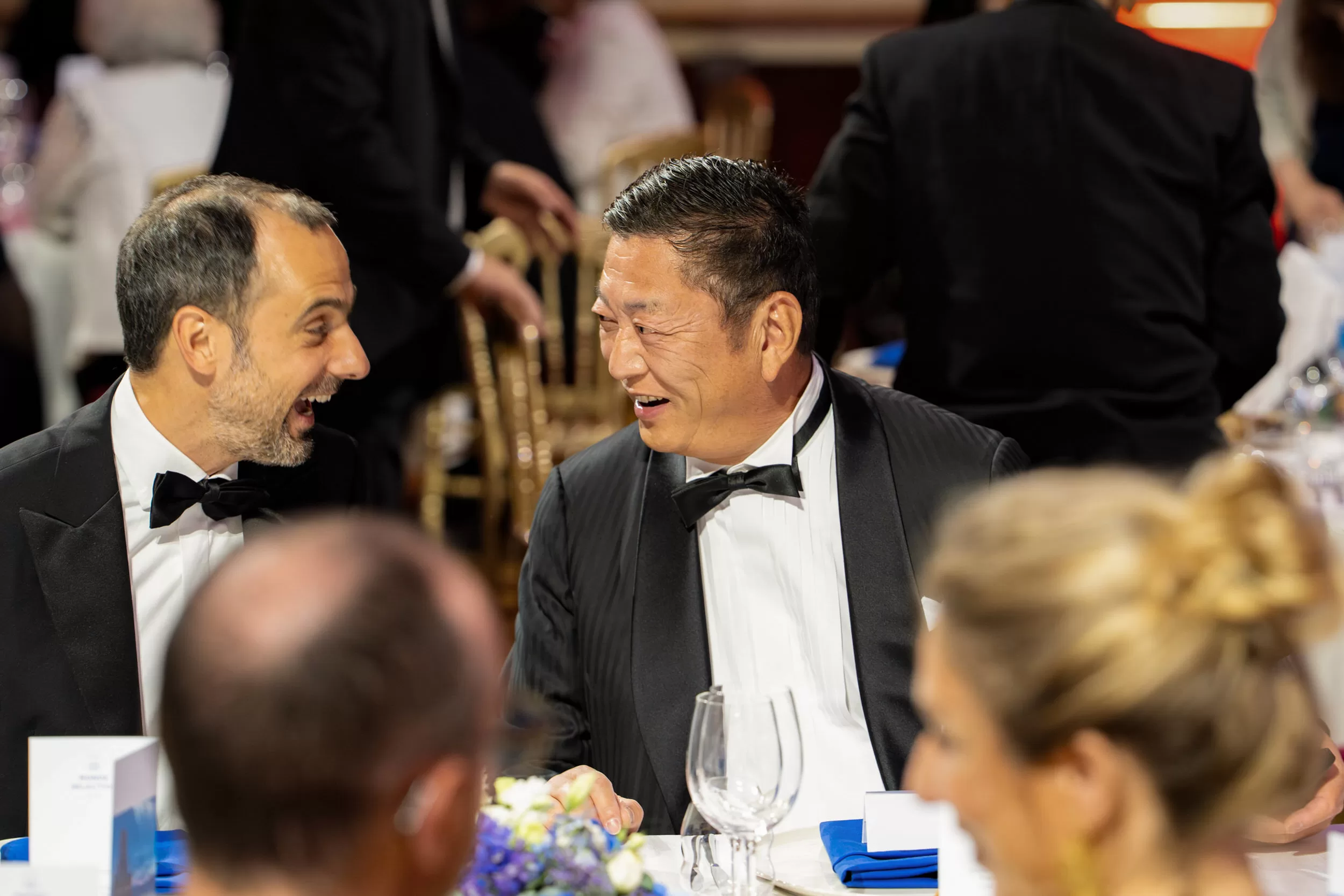 People chatting at a gala dinner