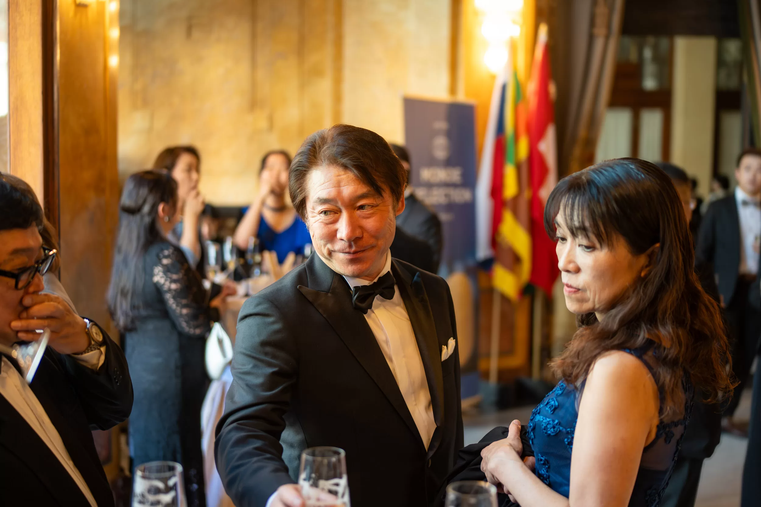 people clinking glasses on an event reception before a gala dinner