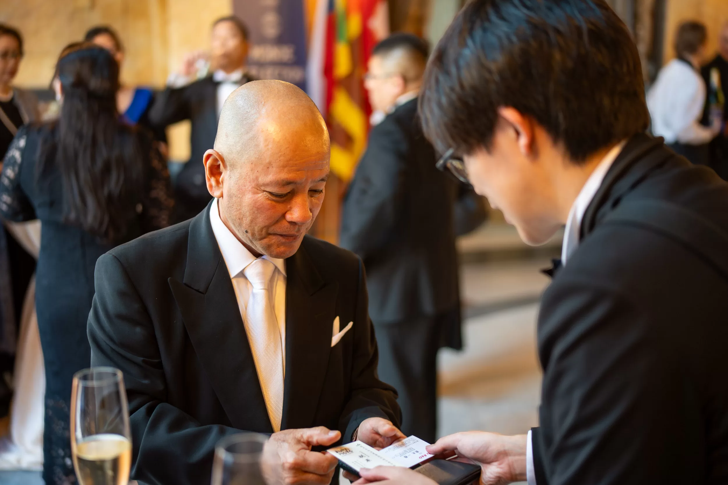 People exchanging business cards on an event
