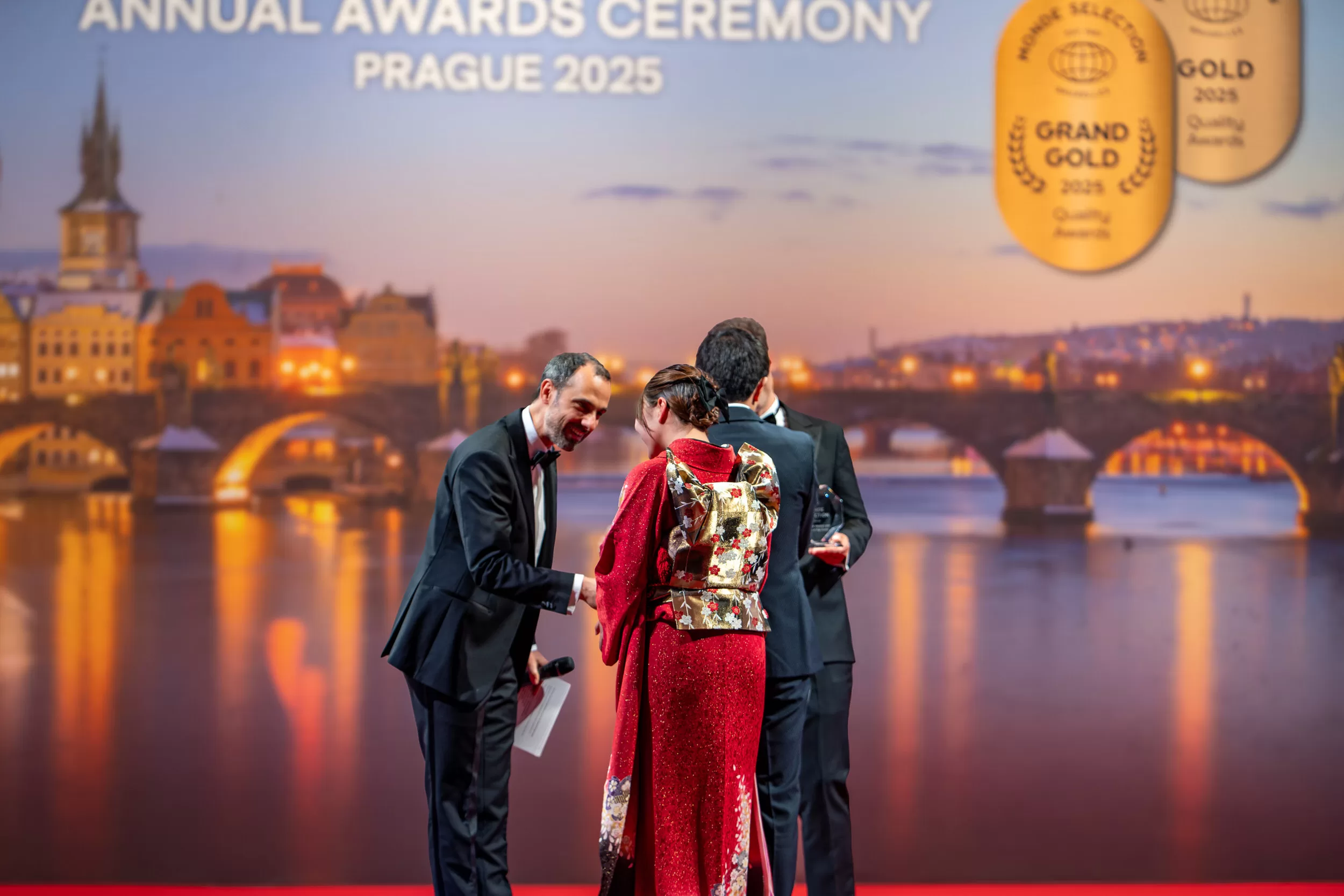 People being awarded on a stage