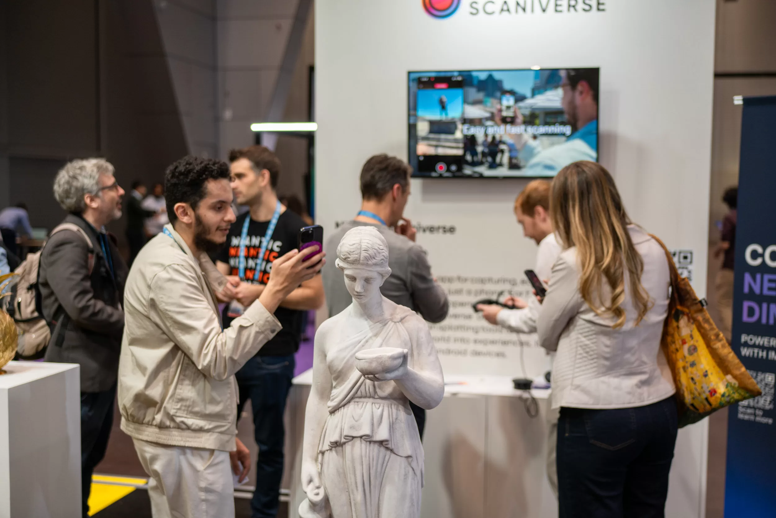 People on expo trying out new tech and discussing new products in a booth by photographer Fedor Vasilev