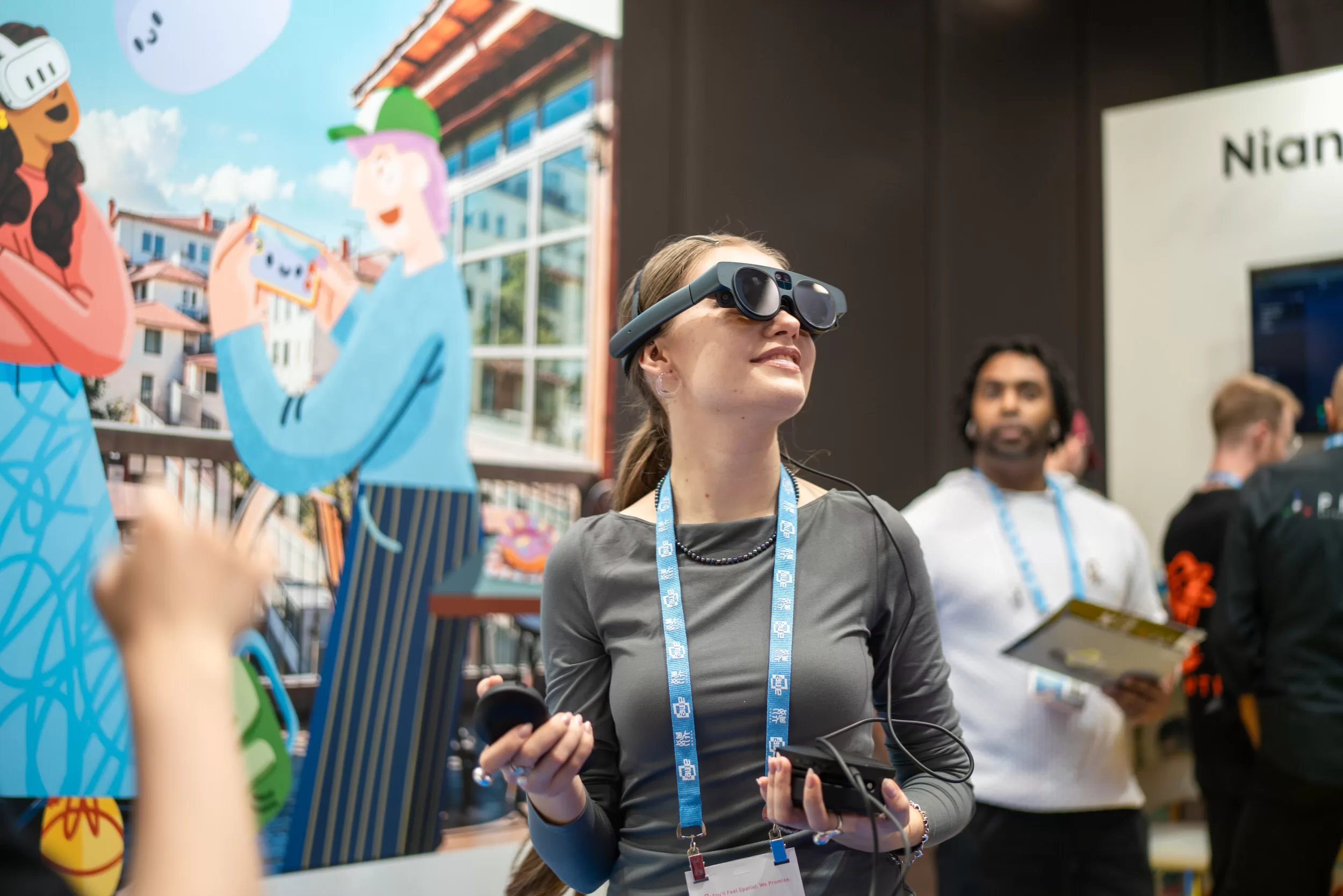 Woman trying out ar glasses in a trade fair booth