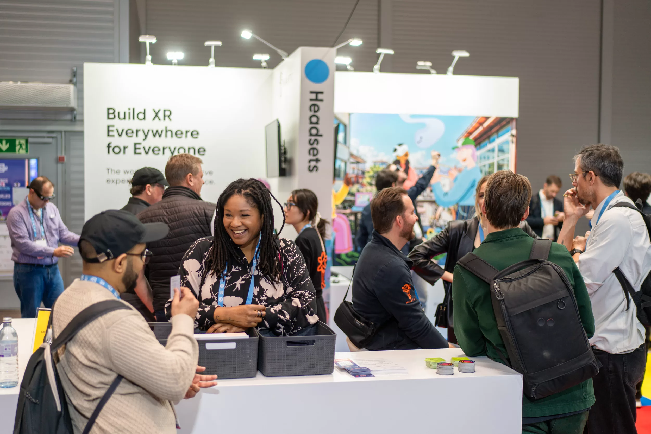 Expo photography coverage by Fedor Vasilev people arriving at a booth to try out vr products