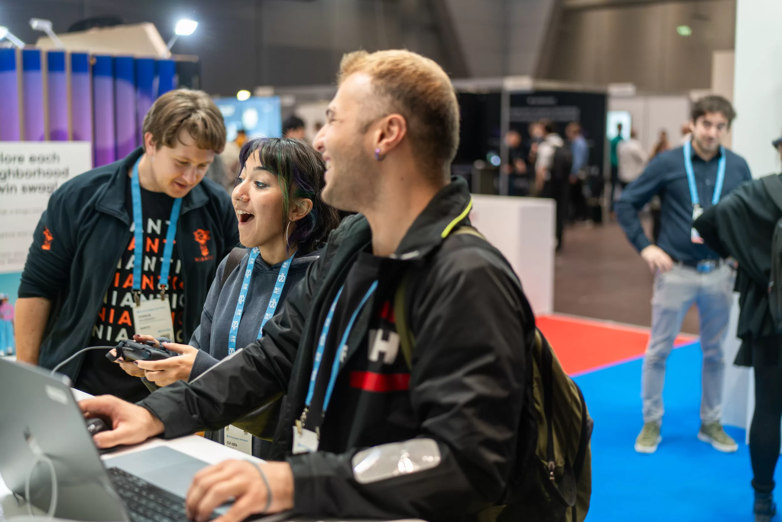 People playing with new product at a trade fair
