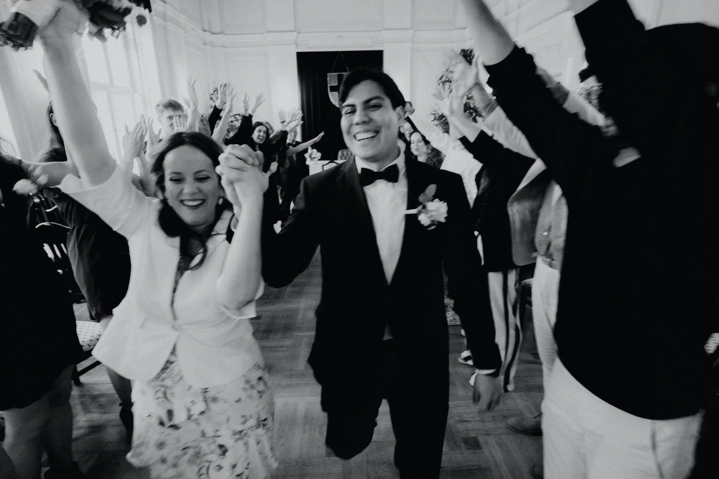 Couple running through the ceremony hall on their wedding in vienna registry office in 16th district