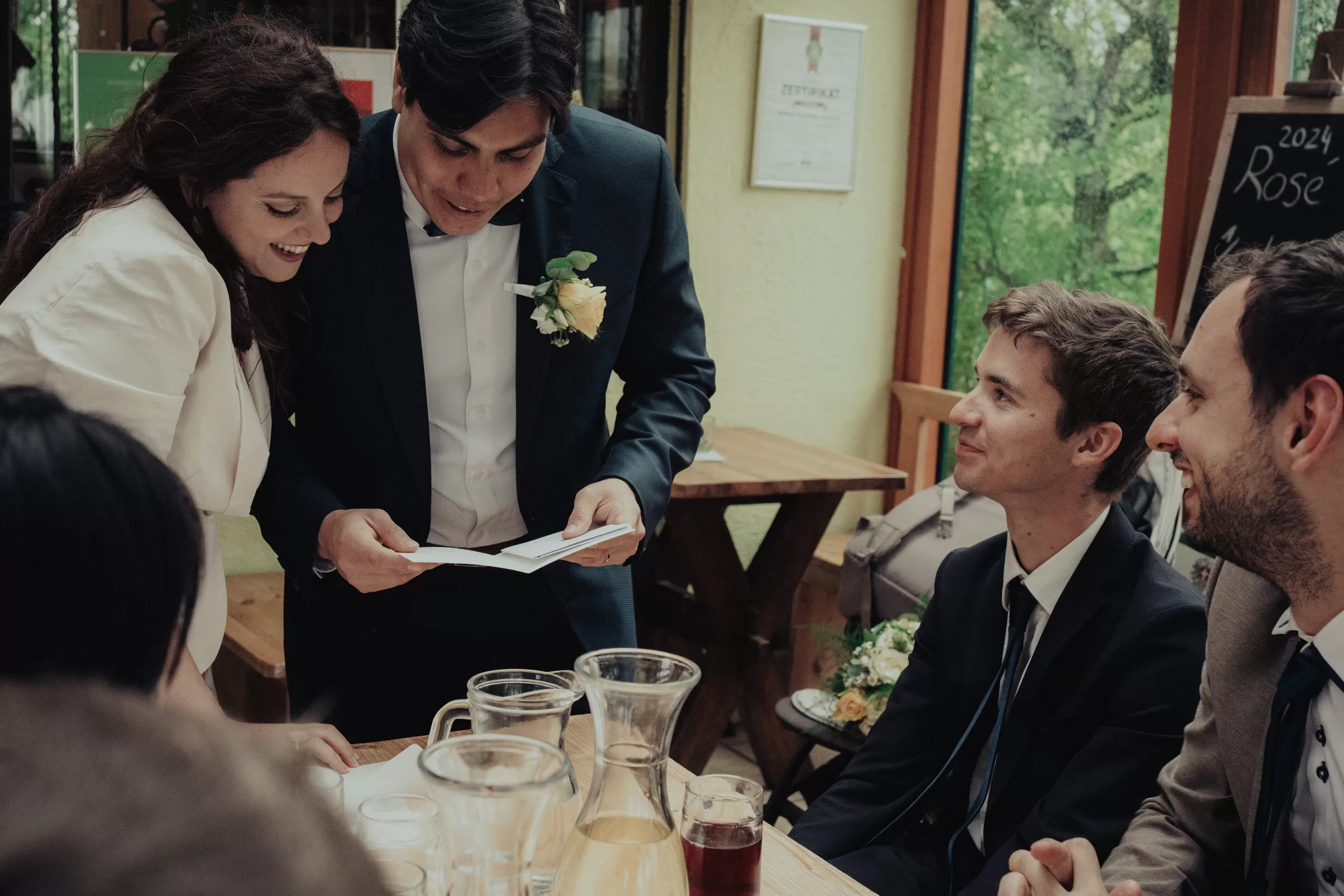 Couple looks at their gifts on their wedding day on a rustic wedding in vienna