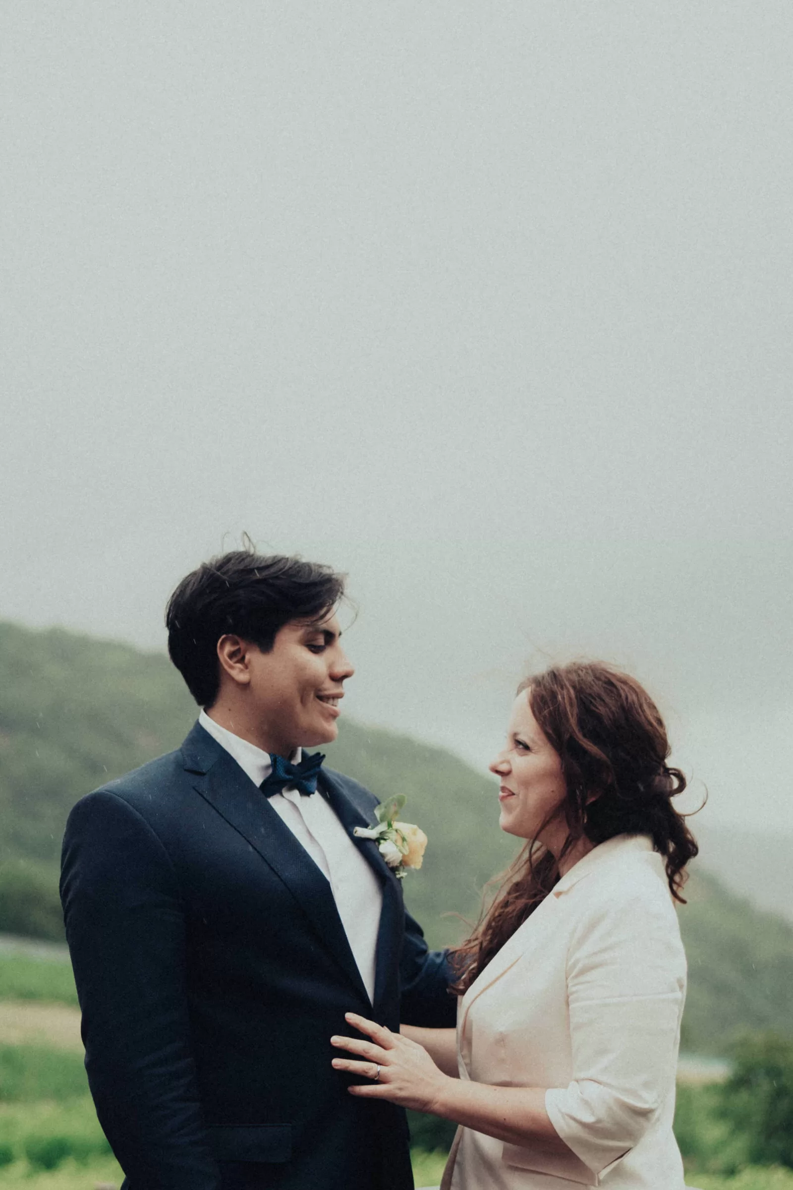 Couple on their wedding day with overcast sky on the hills near vienna