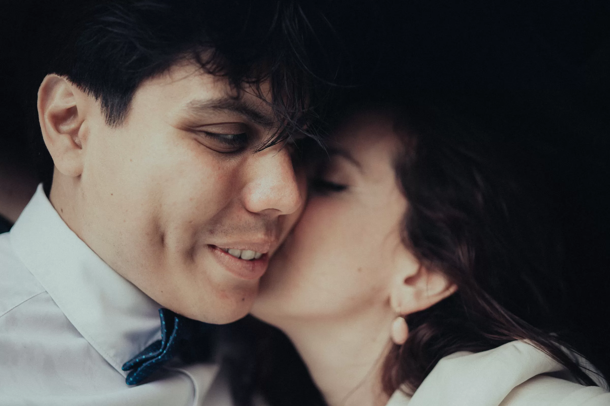 closeup photo of newlyweds kissing