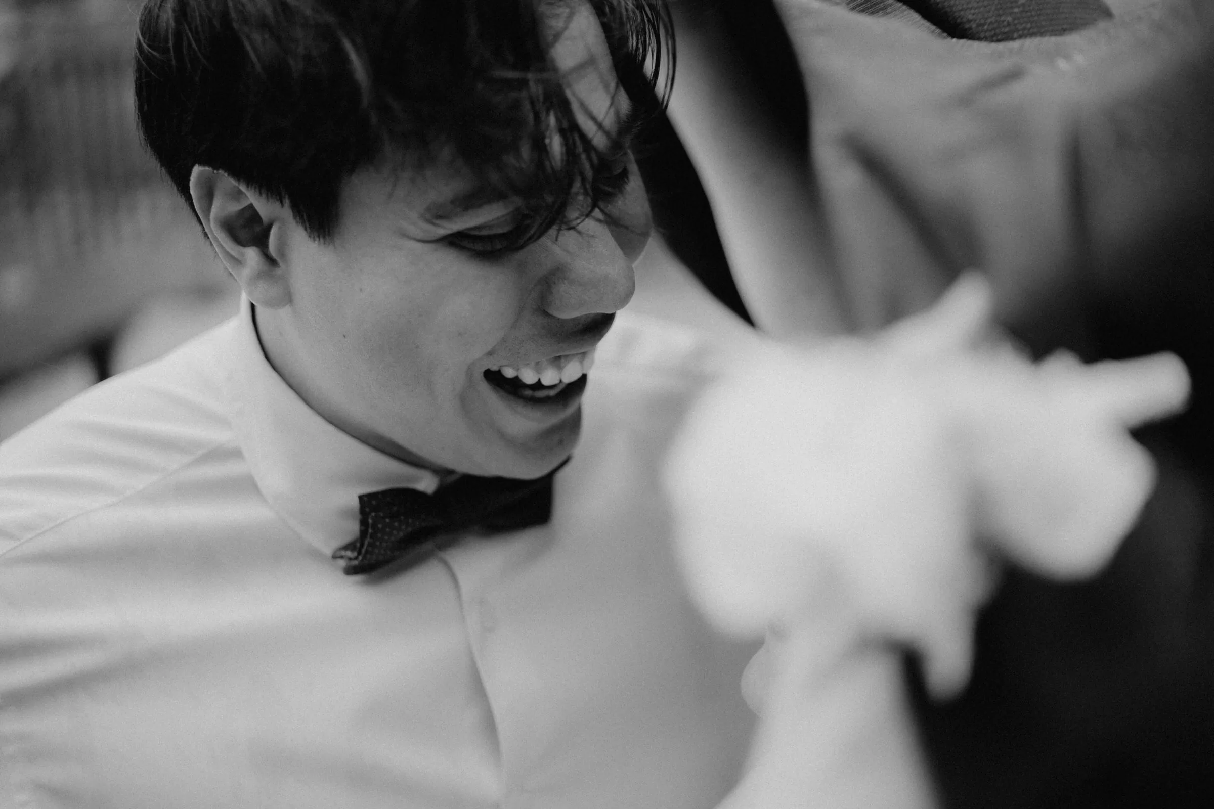 lifestyle photo of groom on a wedding photoshoot on a rainy day