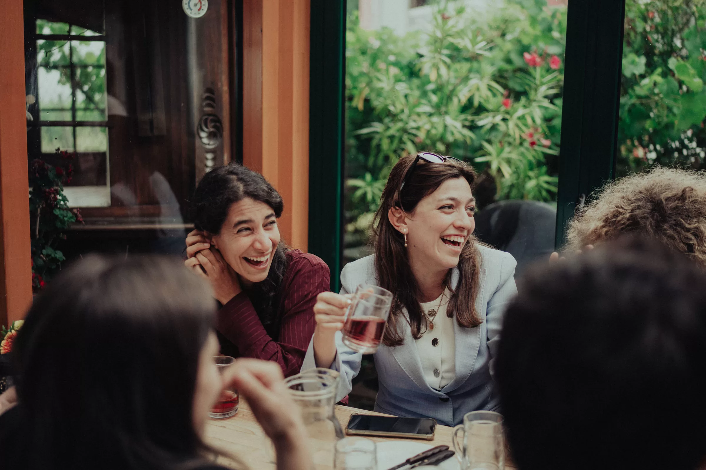Guests of a wedding in a heuriger on the hilld in Nußdorf
