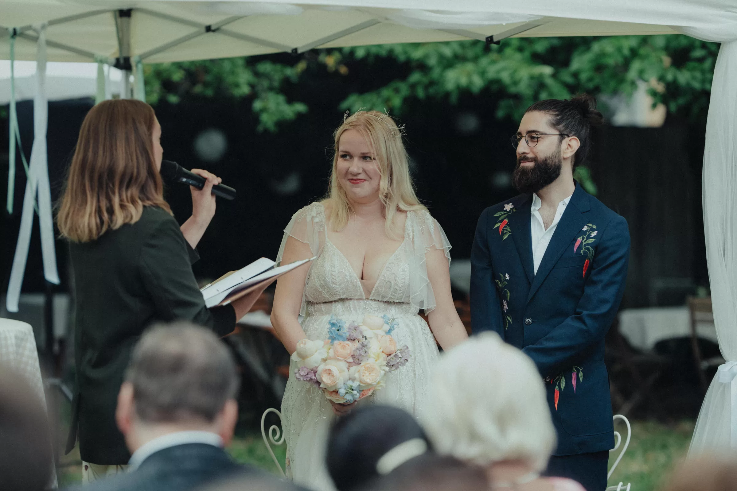 Couple on their wedding ceremony in a garden on a rainy day in 19th district of Vienna