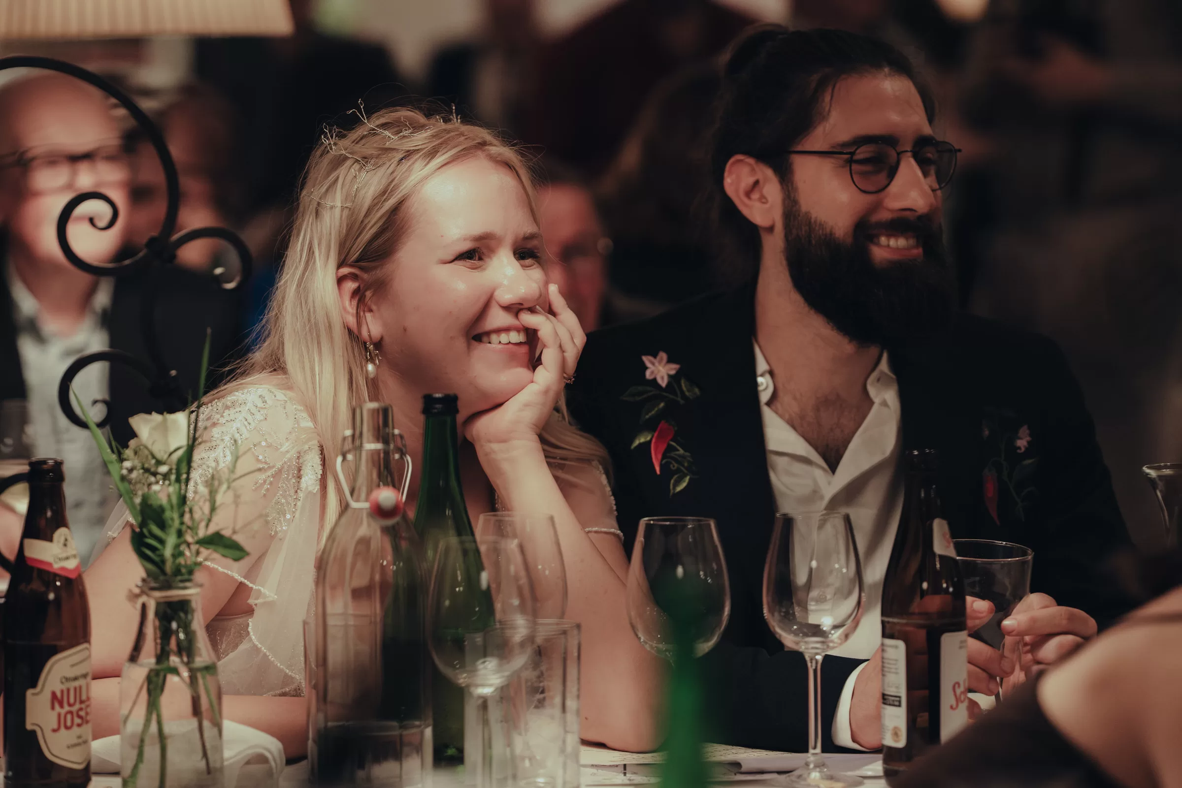 Couple at a wedding in a venue at their table