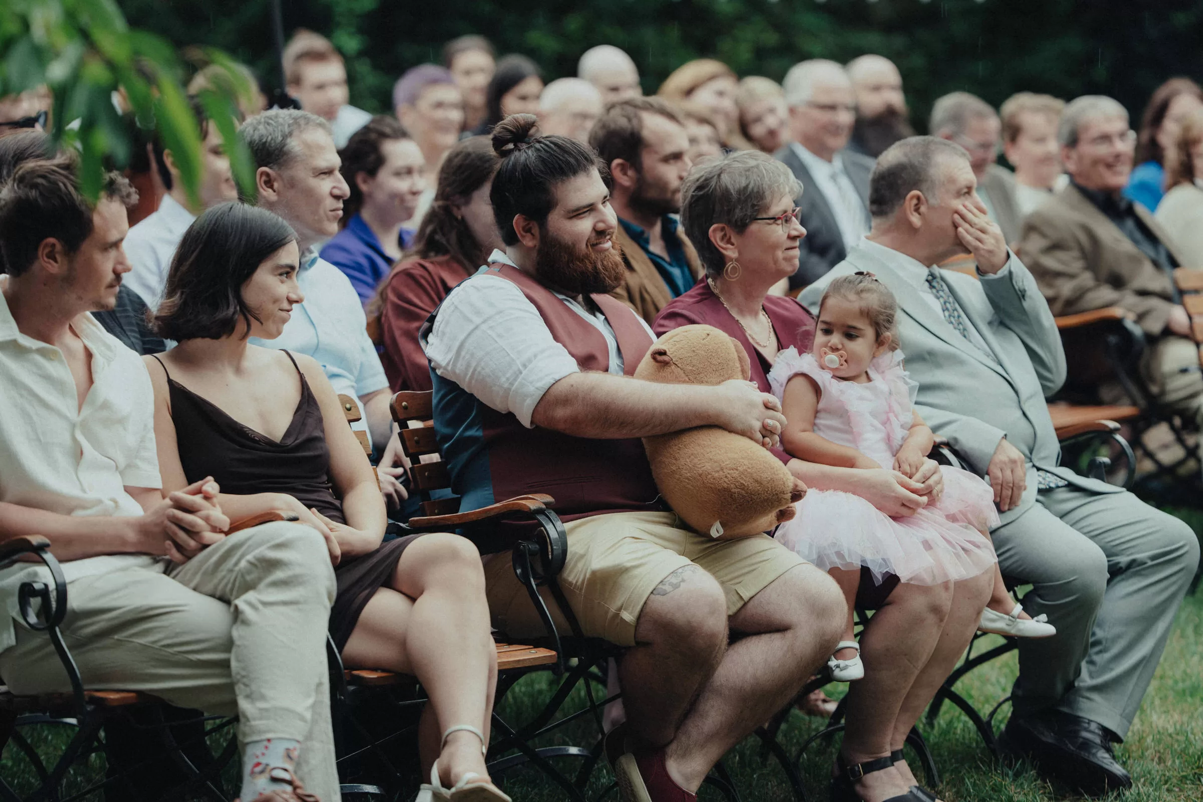 Guests of a wedding on a garden ceremony