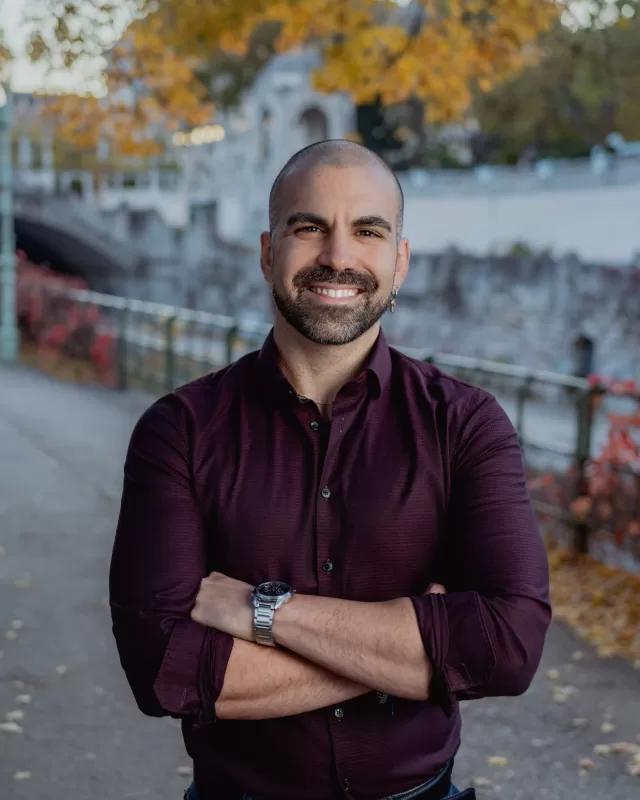 Photographer in Vienna Fedor Vasilev Photographer In Vienna Portrait of a smiling man stading in Stadtpark, Vienna next to Wien Fluss