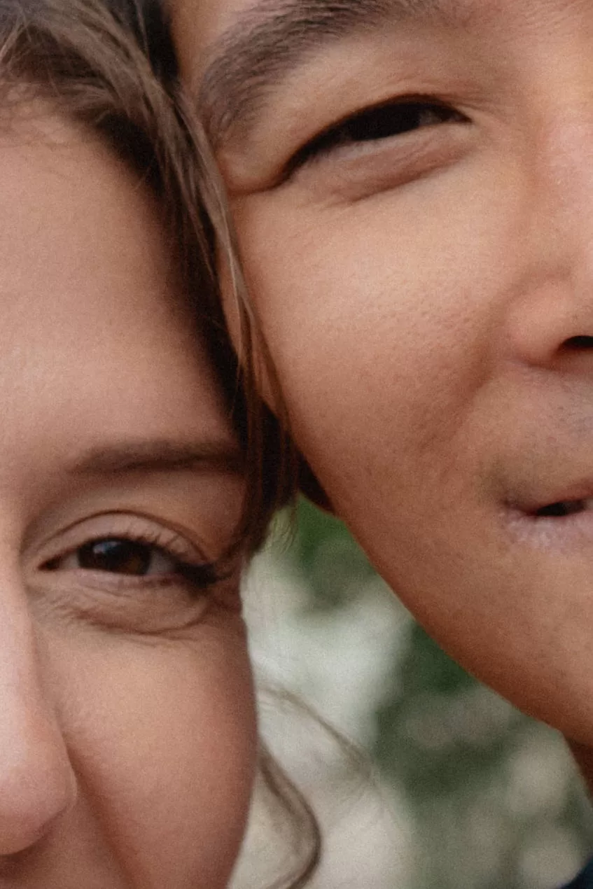 Closeup portrait of a couple leaning on each other