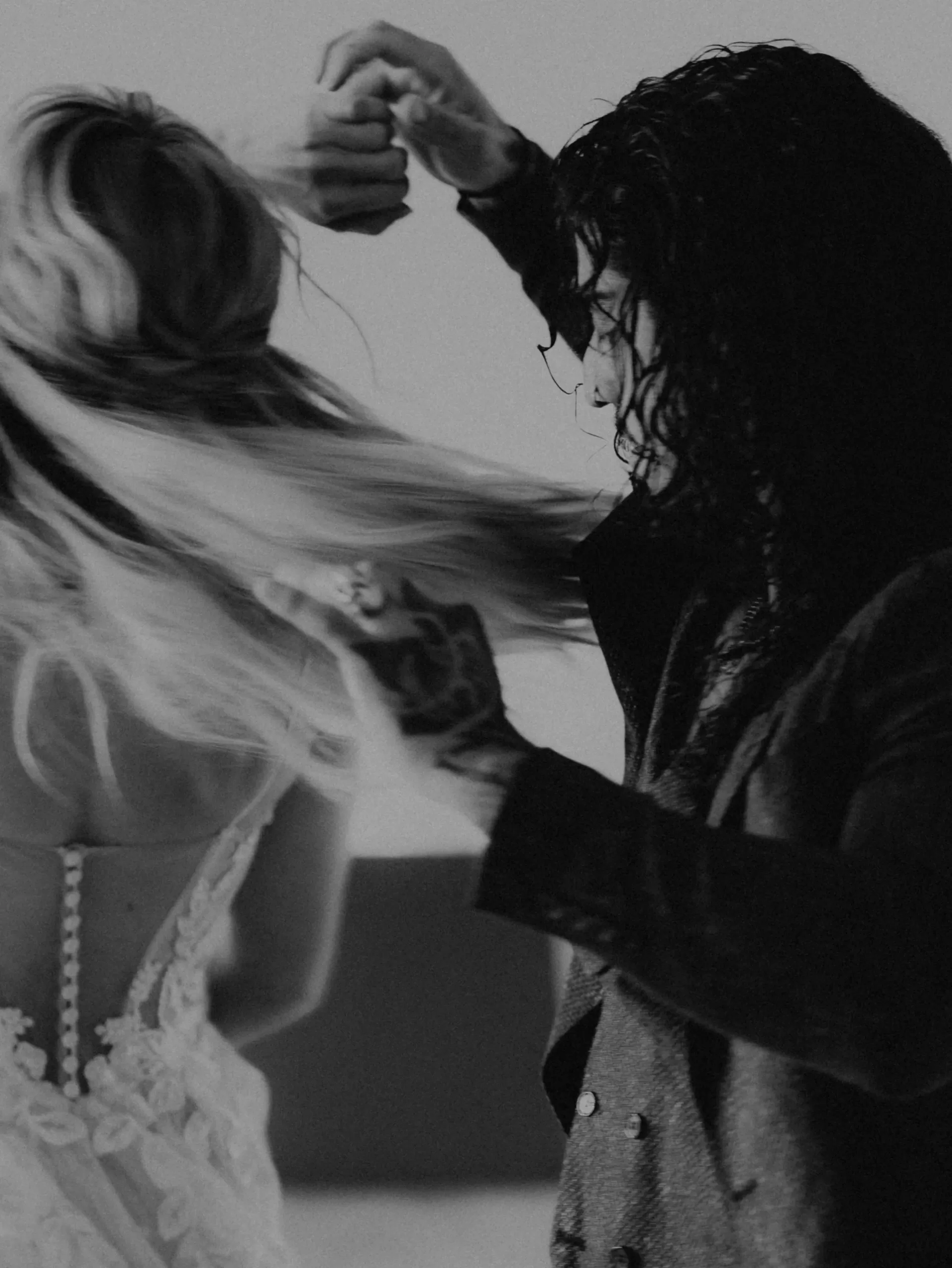 A wedding couple actively dancing at a wedding venue in austria black and white photo