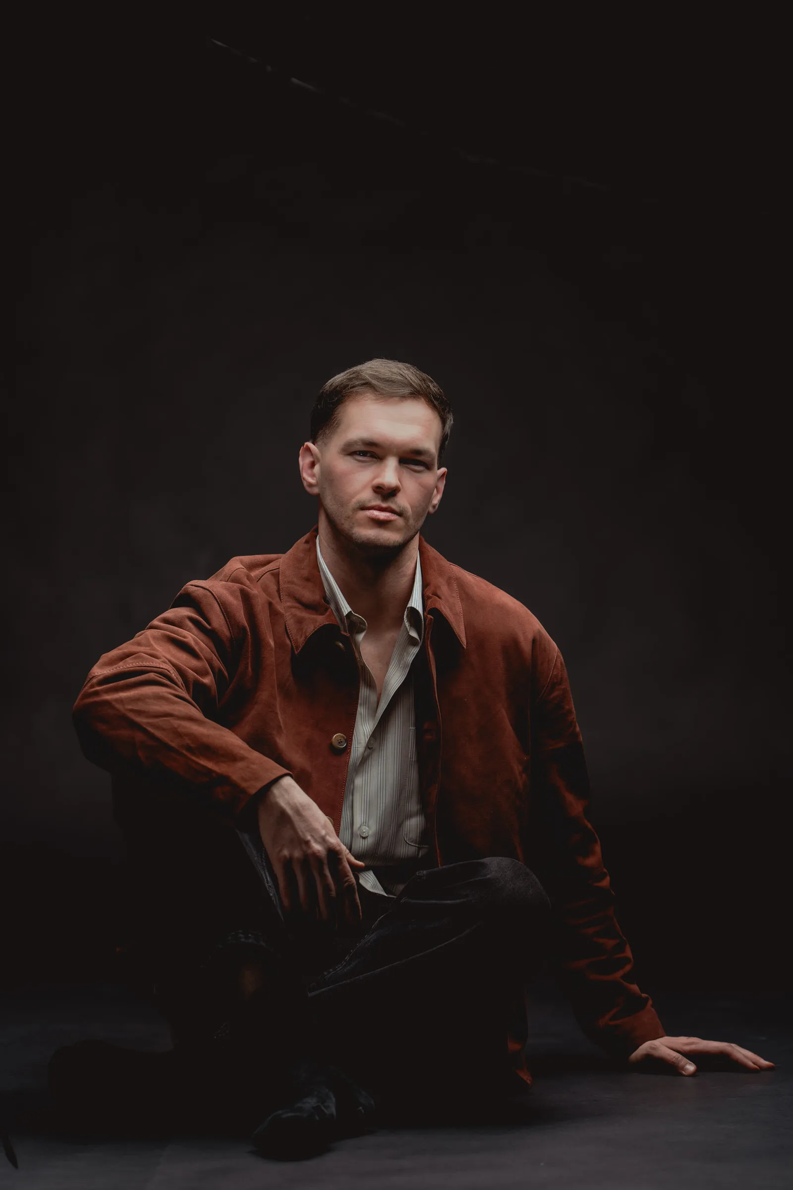 Dramatic portrait of a man on a black backdrop