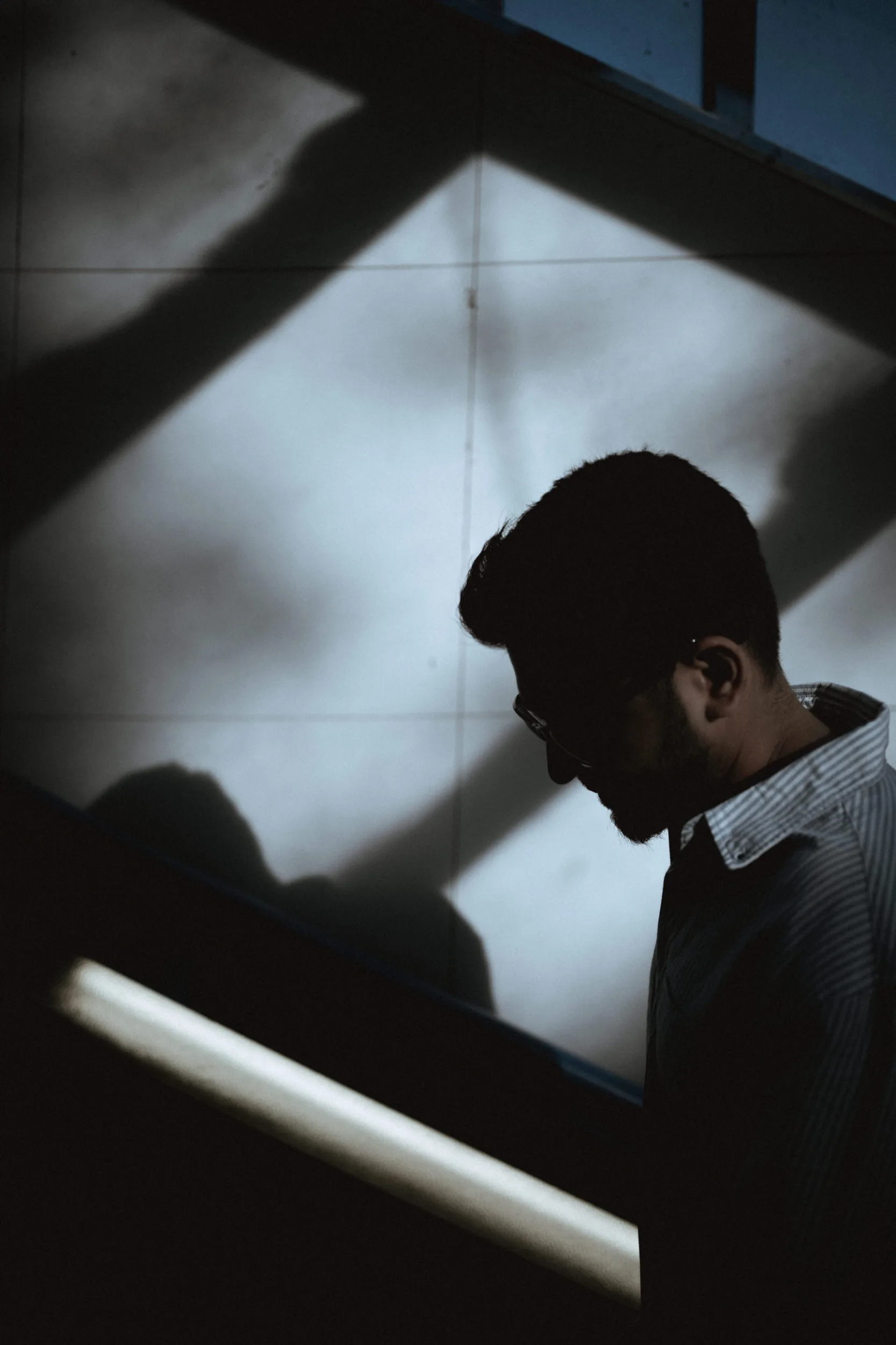 Silhouette of a man walkin up the stairs in Berlin U-bahn