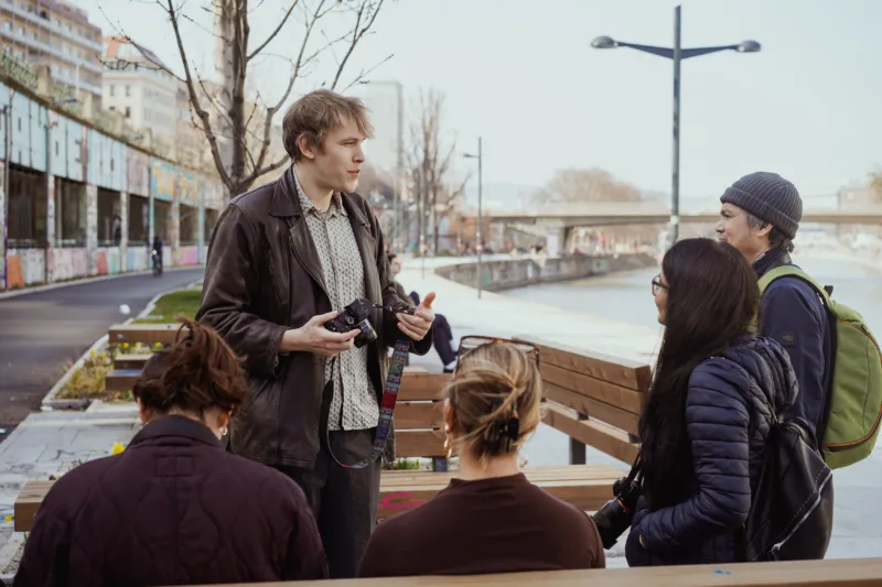 Trainer on a photography workshop with students Fedor Vasilev teaching people on a photography workshop