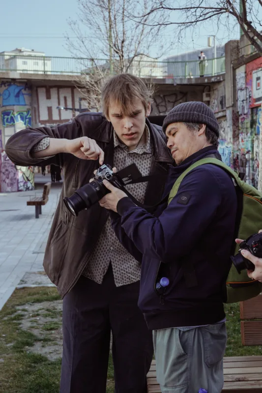 Photography Workshops in Vienna — Spring 2026 | Light, Composition & Storytelling Fedor Vasilev Photographer In Berlin & Vienna Fedor Vasilev helping out a student on a workshop