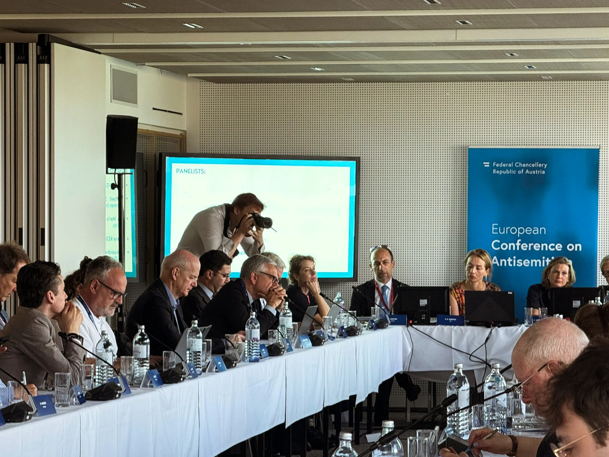 Behind the scenes photo of Fedor Vasilev covering a european commission conference
