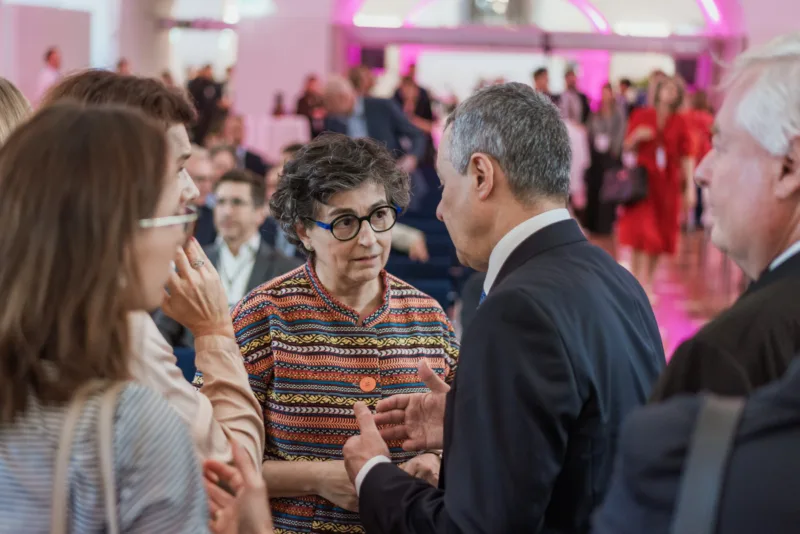 Officials networking before the start of a conference