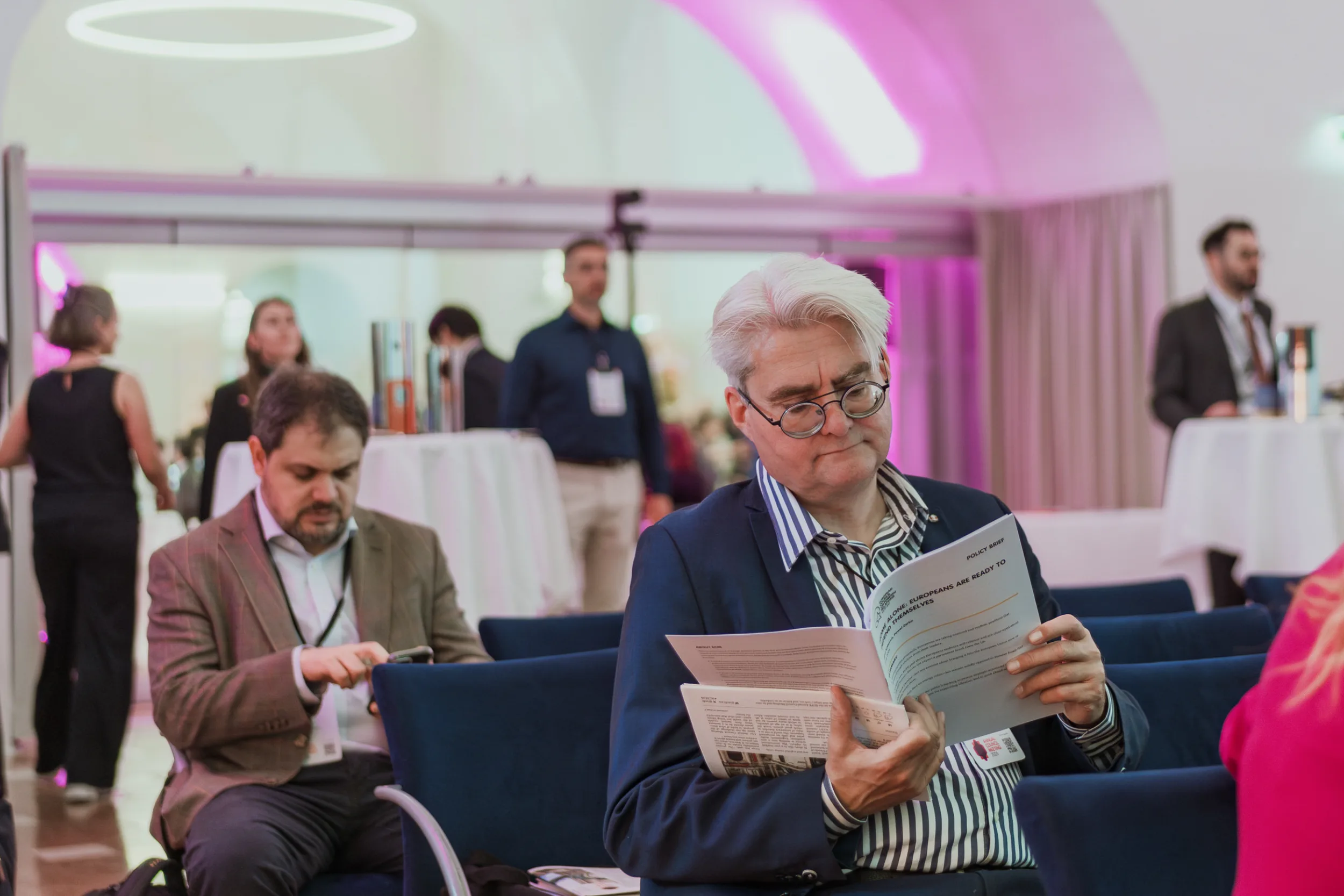 European Council on Foreign Relations Annual Council Meeting | Institutional Event Photographer Fedor Vasilev Photographer In Berlin A man reading a newspaper at the start of the conference in National library in Vienna