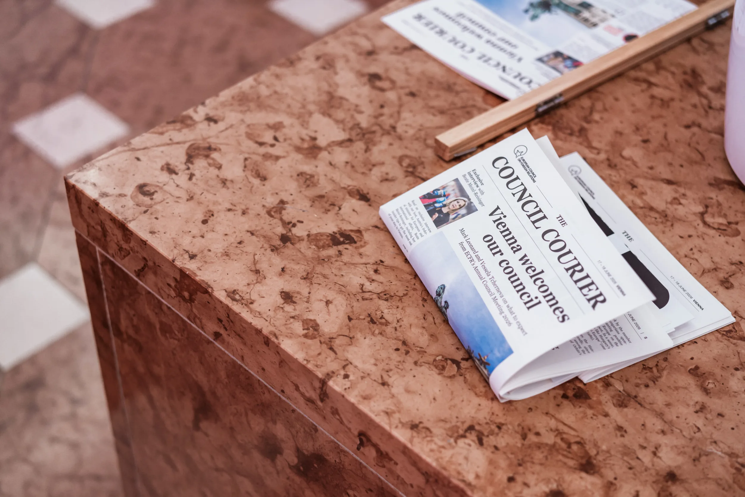 European Council on Foreign Relations Annual Council Meeting | Institutional Event Photographer Fedor Vasilev Photographer In Berlin Atmosphere photo of an event newspaper laying in a venue | Annual council meeting photographed by photographer in Berlin Fedor Vasilev