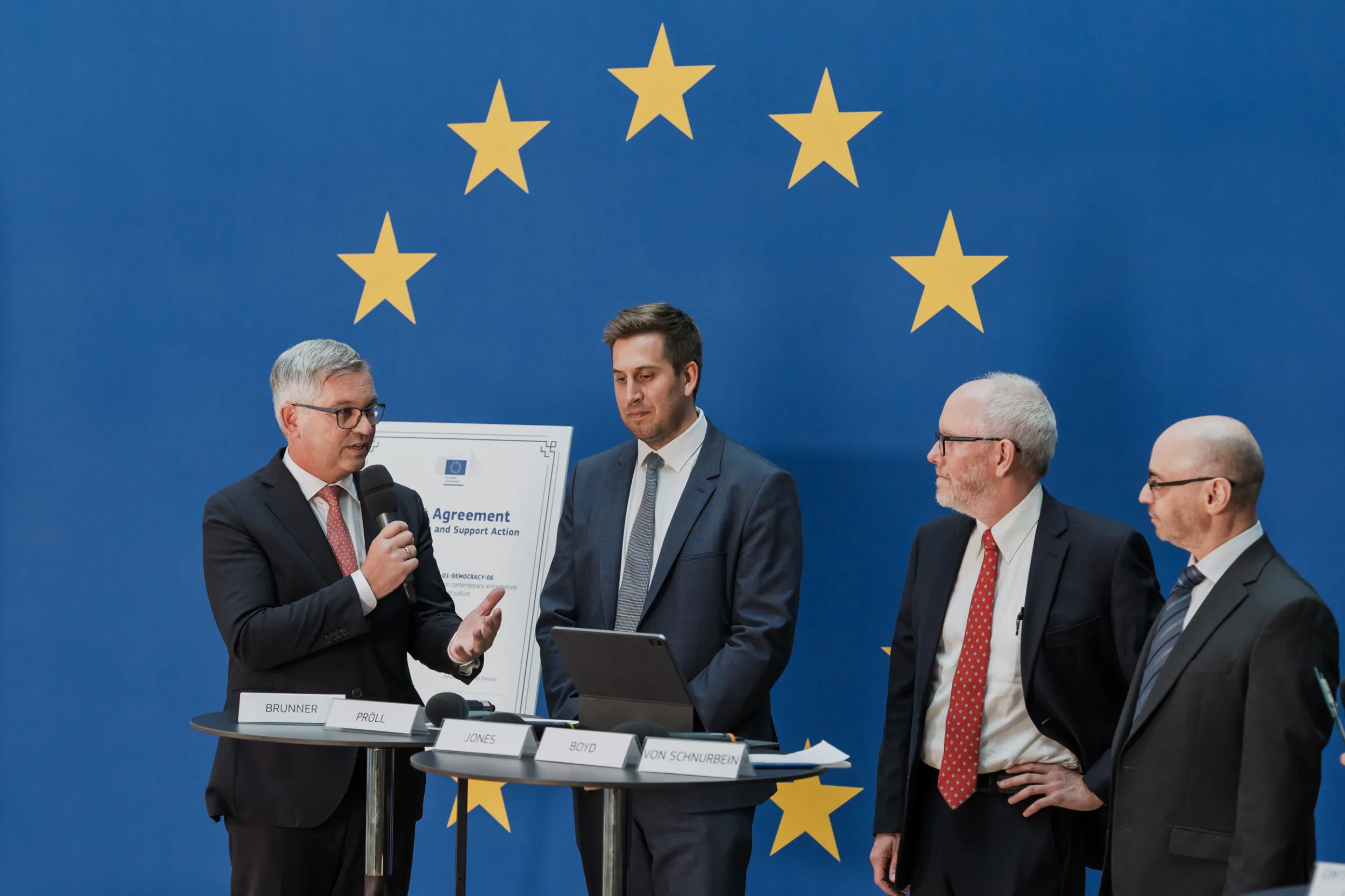 European Union Event Photographer | Grant Signing Ceremony in Vienna Fedor Vasilev Photographer In Berlin Speakers photographed during a formal signing event in Vienna